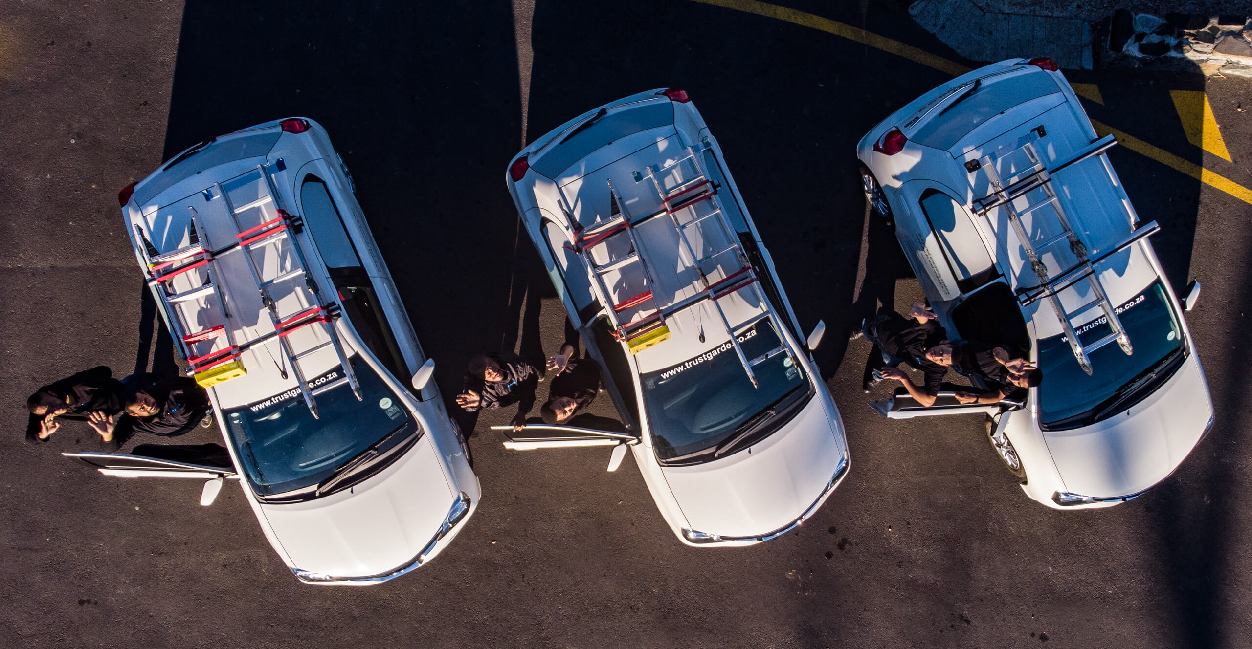 The Trust Garde installation team and service vehicles